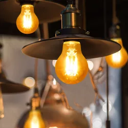 Żarówka LED Filament Bursztynowa A60 E27 8W 2200K 750lm do salonu energiooszczędna