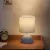 Ceramiczna lampa stołowa z trzonkiem E14 do przytulnego wnętrza - jasnoniebieska ceramiczna podstawa z fakturą